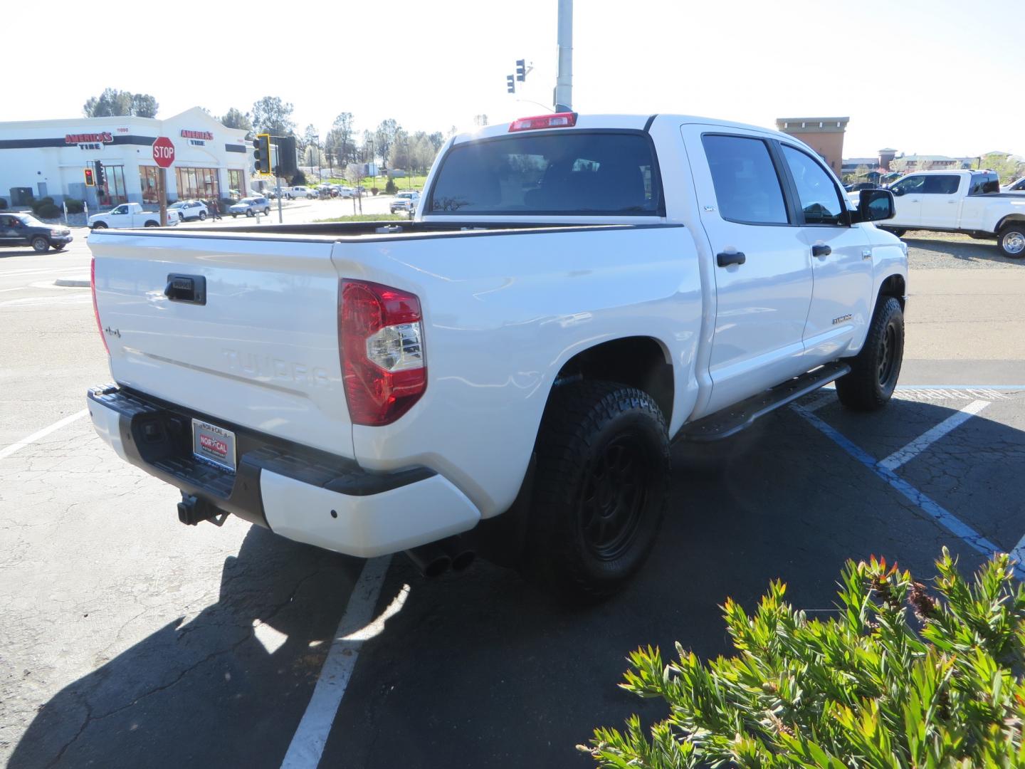 2020 White /GREY Toyota Tundra SR5 (5TFDY5F19LX) with an 5.7L engine, automatic transmission, located at 2630 Grass Valley Highway, Auburn, CA, 95603, (530) 508-5100, 38.937893, -121.095482 - Features - King Off Road adjustable remote reservoir coil overs, King 2.5 adjustable remote reservoir rear shocks, Method Race wheels, Falken Wildpeak tires, Sliders, Bed braces, Borla Exhaust, Husky floor mats, Window tint, and Ram phone mounts. - Photo#4